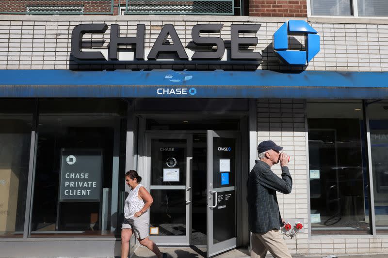 People walk by a Chase bank branch in Manhattan, New York City