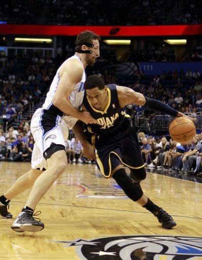 Danny Granger (R) of the Indiana Pacers drives against Hedo Turkoglu of the Orlando Magic in game four of the Eastern Conference quarter-finals during the 2012 NBA Playoffs at Amway Center in Orlando, Florida. The Indiana Pacers squandered a big fourth-quarter lead but held on for a 101-99 over-time win over the Orlando Magic