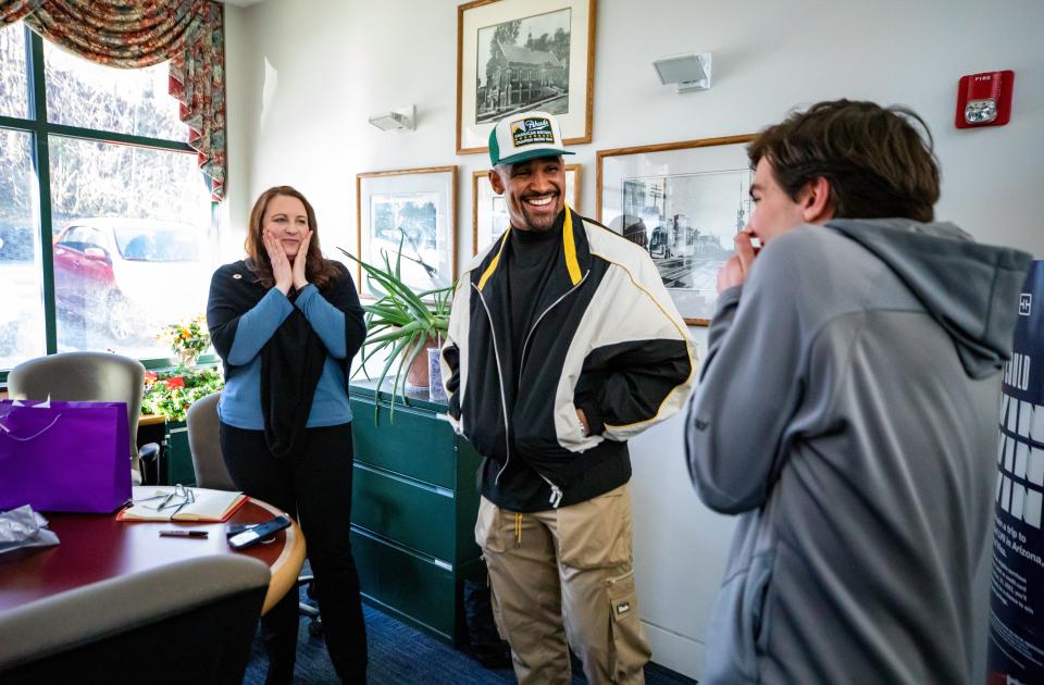 Jalen Hurts surprised Operation HOPE financial coach Allison Sanka, and her son, Evan, for her work with clients.