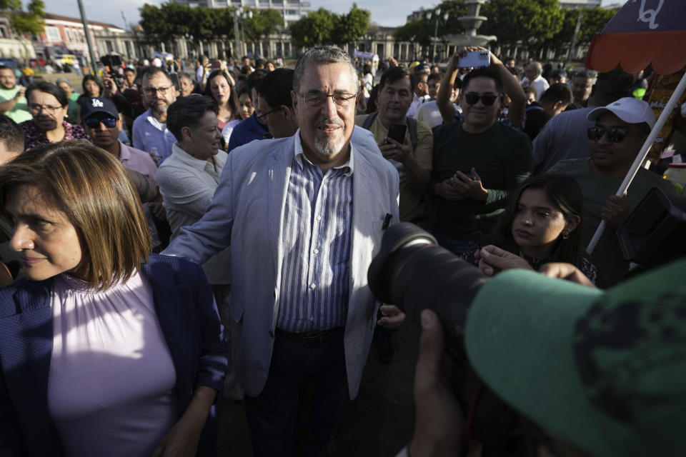 Guatemalan presidential candidate Bernardo Arevalo, center, of the Semilla party arrives to celebrate with supporters at Constitution Square in Guatemala City, Monday, June 26, 2023. Arevalo and former first lady Sandra Torres of the UNE party are going to an Aug. 20 presidential runoff. (AP Photo/Moises Castillo)