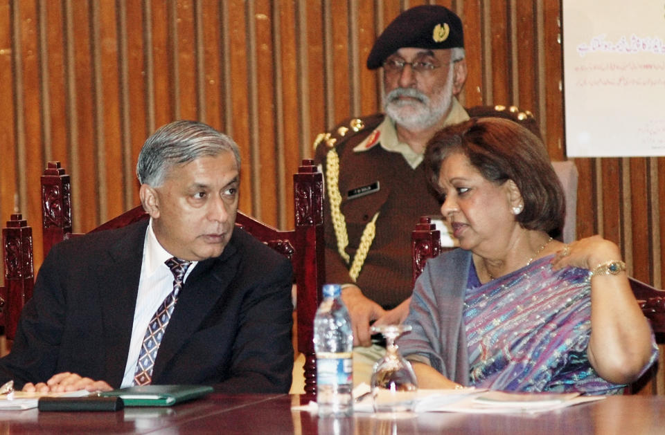 FILE - Pakistan's Prime Minister Shaukat Aziz, left, talks to Nafis Sadik, special representative of UNAID for Asia Pacific during an inaugural session of the first Asia/Pacific Women, Girl and HIV/AIDS Best Practices Conference in Islamabad, Pakistan, on Nov 29, 2004. Sadik, a Pakistani doctor who championed women's health and rights and spearheaded the breakthrough action plan adopted by 179 countries at the 1994 U.N. population conference, died four days before her 93rd birthday, her son said late Monday, Aug. 15, 2022. Omar Sadik said his mother died of natural causes at her home in New York on Sunday night. (AP Photo/Anjum Naveed, File)