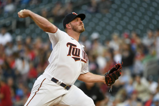 Minnesota Twins pitcher Dylan Bundy throws to a Texas Rangers batter during the first inning of a baseball game Friday, Aug. 19, 2022, in Minneapolis. (AP Photo/Craig Lassig)