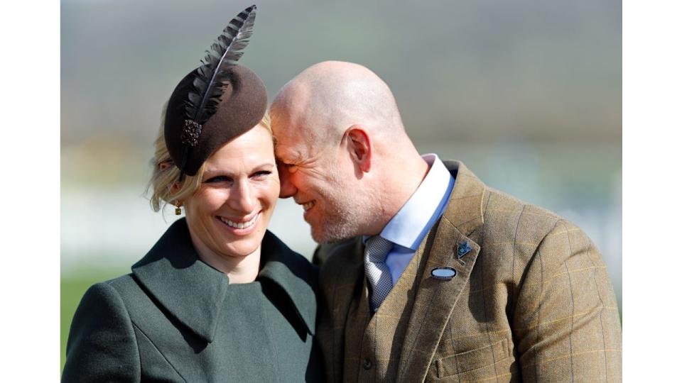 Zara Tindall smiling with Mike Tindall with his face rested on hers 