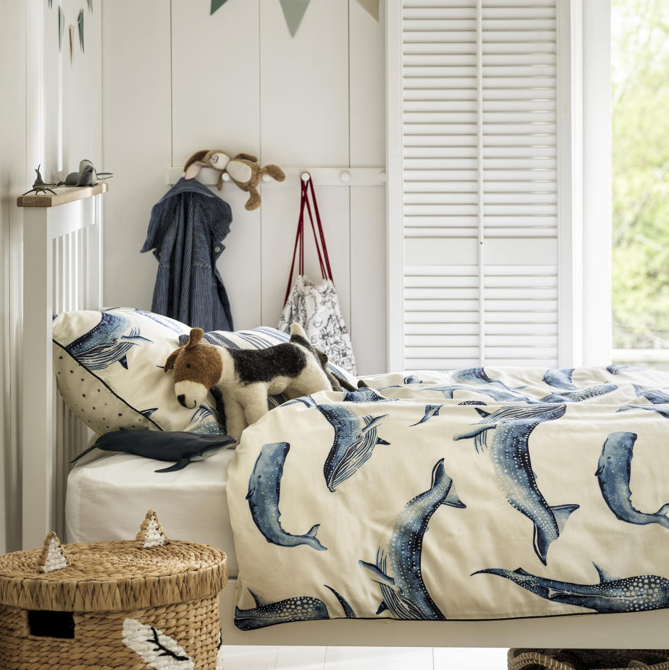 kids bedroom with white walls and shutters