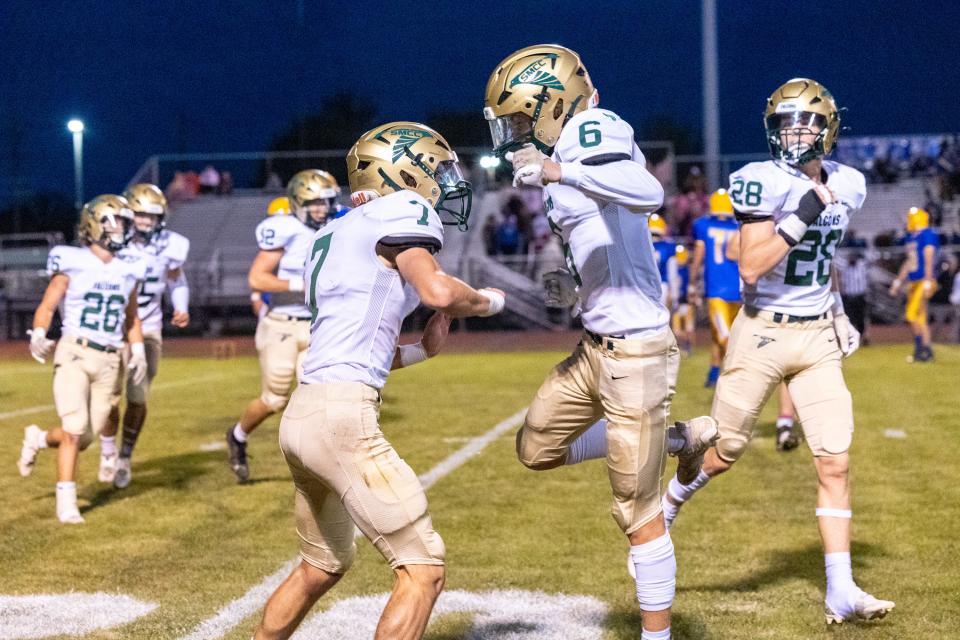 Chase Terrasi of St. Mary Catholic Central (right) celebrates a sack against Jefferson with teammate Andrew Beggs Friday night. SMCC won 41-14.