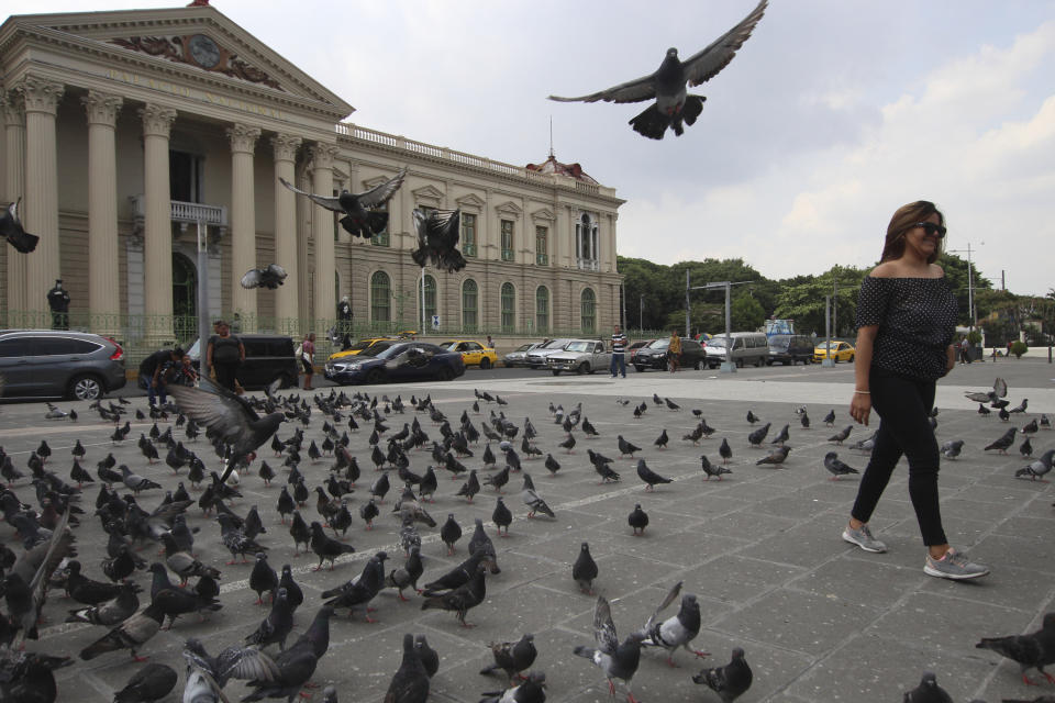 A woman visits the Gerardo Barrios Plaza before the arrival of California Gov. Gavin Newsom in San Salvador, El Salvador, Sunday, April 7, 2019. Newsom visited the tomb of Archbishop Romero, the Salvadoran priest assassinated in 1980 due to his advocacy for human rights and the poor. (AP Photo/Salvador Melendez)