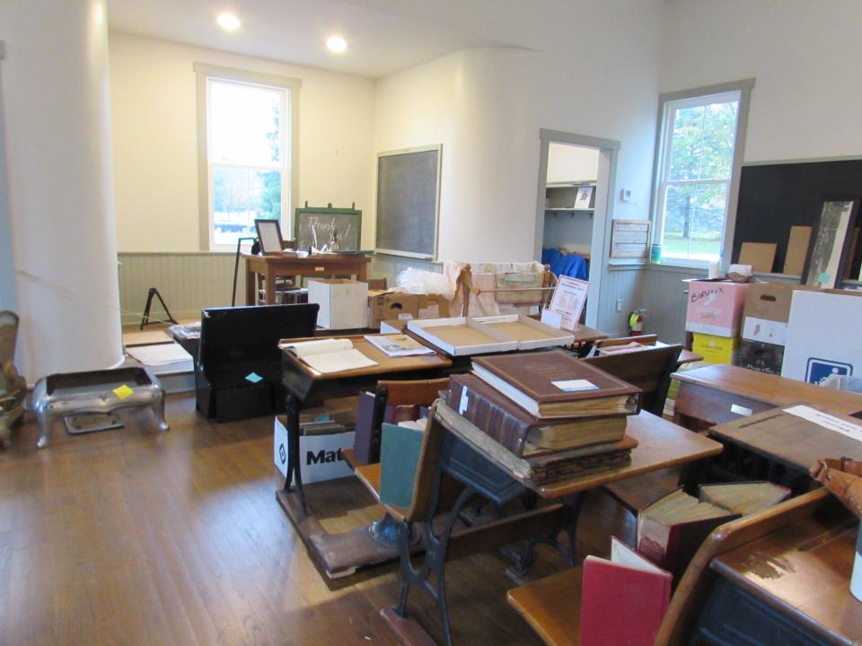 Several items such as old books, records and photos were moved to the School House after the Oct. 15 fire at Heritage House.