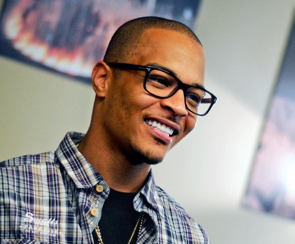 In this Sept. 10, 2012 photo, rapper T.I. is photographed during an interview in Atlanta. Even though T.I. has not produced any major hits lately, the Grammy-winning rapper believes he can still sell a considerable amount of albums based on his stellar track record. (AP Photo/Kat Goduco)