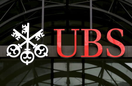 A UBS logo is seen outside a building in central London in this December 10, 2007 file photo. REUTERS/Alessia Pierdomenico/Files