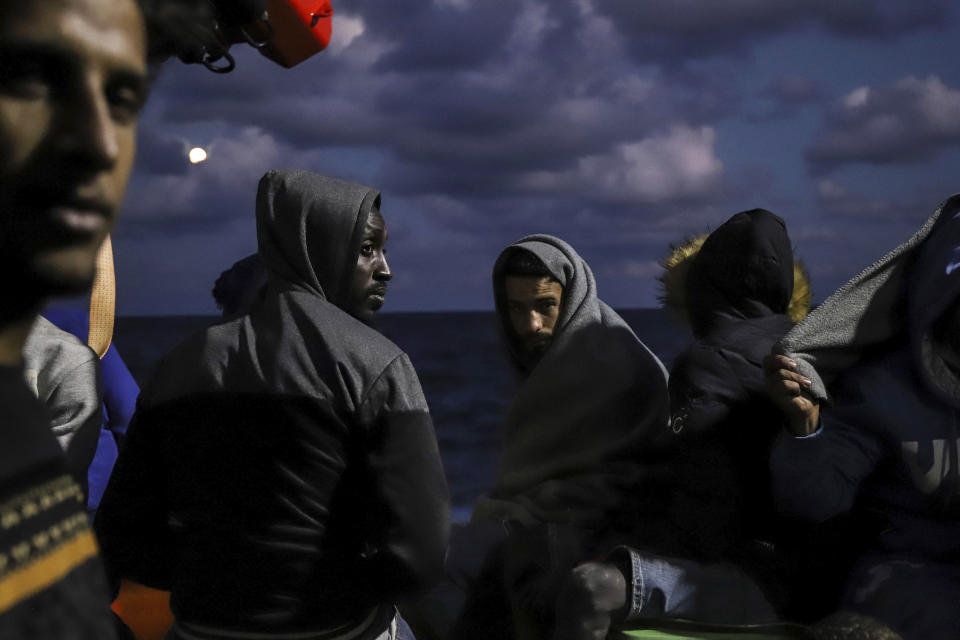 Migrants sit on the deck of the Sea Watch-3 rescue ship in the Maltese search and rescue zone of the Mediterranean Sea on Oct. 19, 2021. IEuropean Union nations will discuss on Tuesday, May 14, 2024, sweeping new reforms to the bloc's failed asylum system as campaigning for Europe-wide elections next month gathers pace, with migration expected to be an important issue. (AP Photo/Valeria Mongelli, File)