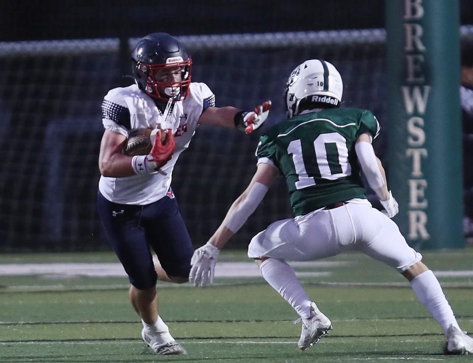 EastchesterÕs Alex Titto (8) tries to get around BrewsterÕs Marco Parrello (10) after a second half catch during football action at Brewster High School Sept. 30, 2023. Eastchester won the game 21-0. 