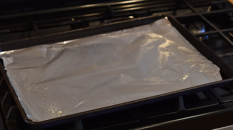 lining baking sheet with foil