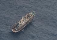 A fishing boat is seen from an aircraft of the Ecuadorian navy after a fishing fleet of mostly Chinese-flagged ships was detected in an international corridor that borders the Galapagos Islands' exclusive economic zone, in the Pacific Ocean