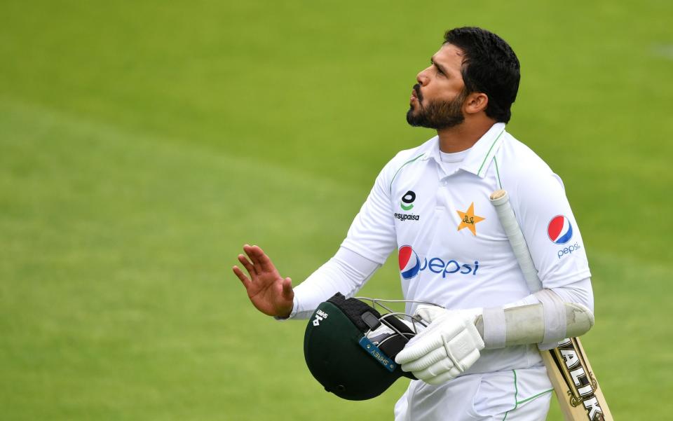 Pakistan's Azhar Ali leaves the field after losing his wicket during the first day of the first Test cricket match between England and Pakistan at Old Trafford in Manchester, northwest England on August 5, 2020. - DAN MULLAN/POOL/AFP via Getty Images