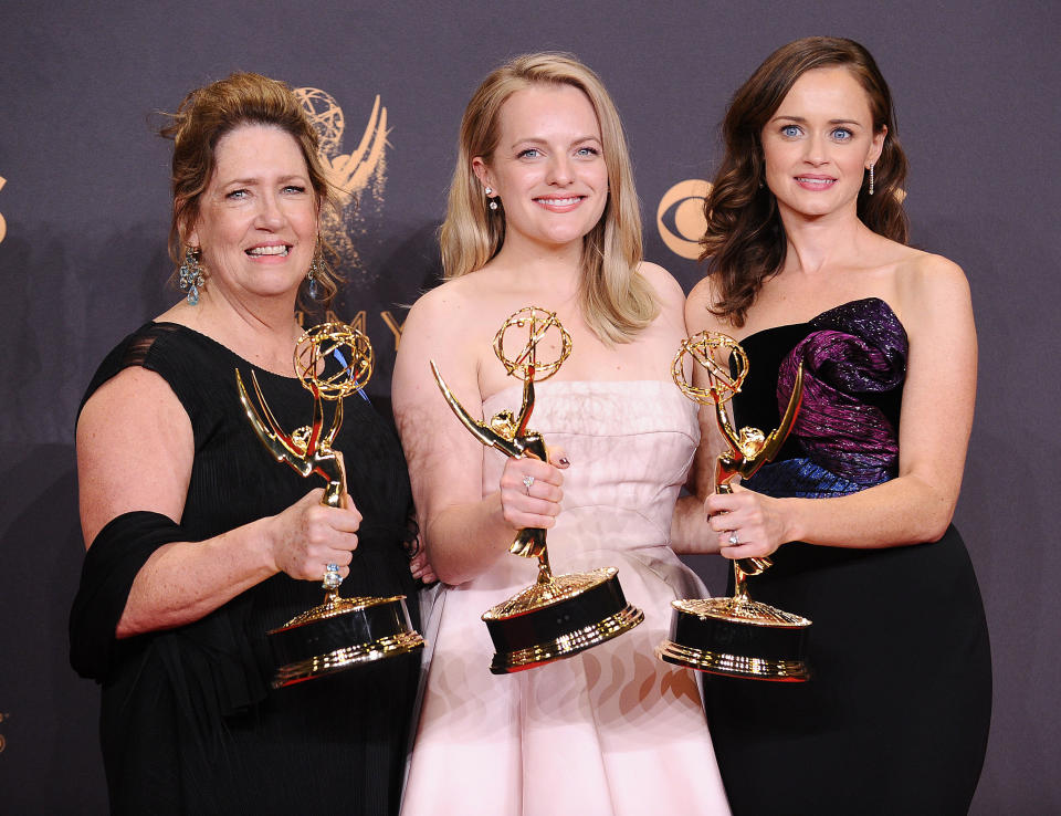 Actors Ann Dowd, Elisabeth Moss and Alexis Bledel pose with their acting Emmys for "The Handmaid's Tale." (Photo: Jason LaVeris via Getty Images)