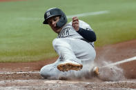 New York Yankees' Gio Urshela scores on a sacrifice fly by DJ LeMahieu off Tampa Bay Rays starting pitcher Michael Wacha during the fifth inning of a baseball game Wednesday, July 28, 2021, in St. Petersburg, Fla. (AP Photo/Chris O'Meara)