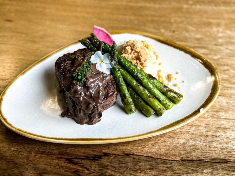Wood fired filet mignon topped with Huntsman sauce and served with grilled asparagus and garlic mashed potatoes with parmesan streusel.