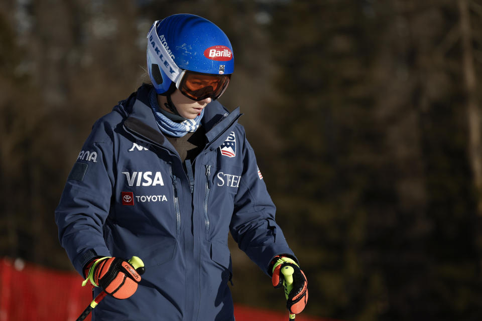 United States' Mikaela Shiffrin concentrates ahead of an alpine ski, women's World Cup downhill race, in Cortina d'Ampezzo, Italy, Friday, Jan. 26, 2024. Shiffrin crashed into the safety nets after losing control landing a jump during a World Cup downhill on Friday. (AP Photo/Gabriele Facciotti)