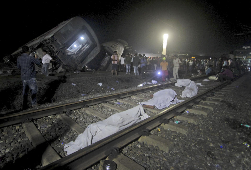 Bodies recovered from passenger trains lay on the track at the site of an accident, in Balasore district, in the eastern Indian state of Orissa, Saturday, June 3, 2023. Two passenger trains derailed in India, killing more than 200 people and trapping hundreds of others inside more than a dozen damaged rail cars, officials said. (AP Photo)