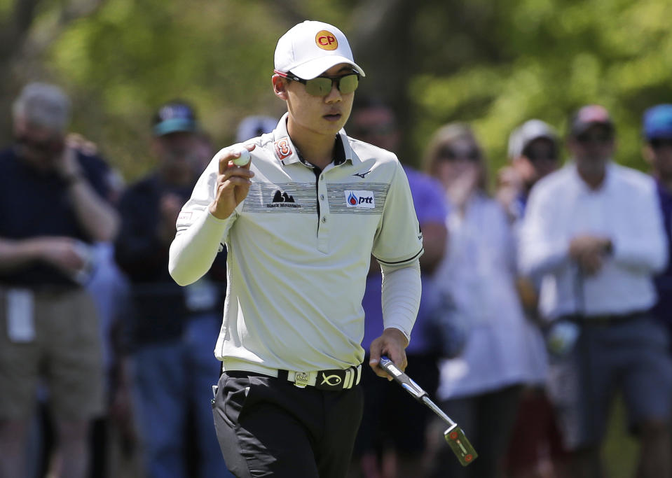 Jazz Janewattananond, of Thailand, reacts after sinking a putt for birdie on the third green during the third round of the PGA Championship golf tournament, Saturday, May 18, 2019, at Bethpage Black in Farmingdale, N.Y. (AP Photo/Seth Wenig)