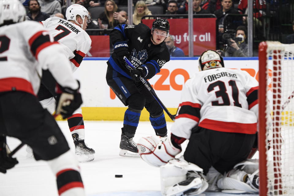 Toronto Maple Leafs forward David Kampf (64) shoots on Ottawa Senators goaltender Anton Forsberg (31) during the second period of an NHL hockey game Friday, Jan. 27, 2023, in Toronto. (Christopher Katsarov/The Canadian Press via AP)