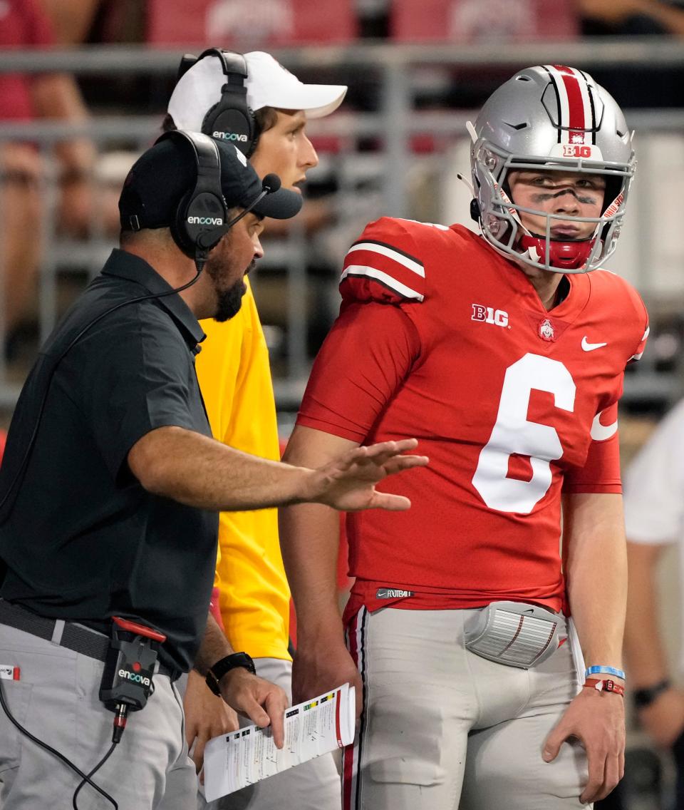 Ohio State head coach Ryan Day talks toquarterback Kyle McCord (6) on the sideline. (Barbara Perenic, Columbus Dispatch)