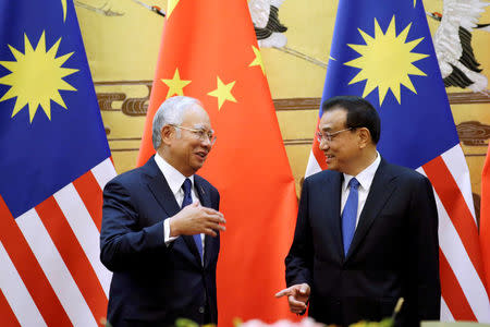 Malaysia's Prime Minister Najib Razak and China's Premier Li Keqiang attend a signing ceremony at the Great Hall of the People, in Beijing, China, November 1, 2016. REUTERS/Jason Lee/File Photo