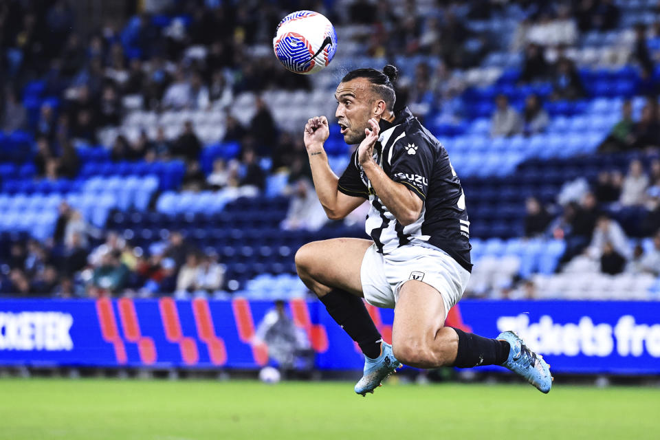 Macarthur FC player Clayton Lewis heads the ball during an A-League match against Sydney FC in Sydney, May 4, 2024. Lewis and fellow players Kearyn Baccus and Ulises Davila have been arrested, Friday, May 17, 2024, over their alleged involvement in a the betting fix, which police say has led to hundreds of thousands of dollars being paid out in winnings. (Mark Evans/AAP Image via AP)