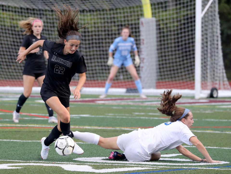 Albertus Magnus' Ashley McMahon (22, left) earned a spot on the U-17 Puerto Rico Women's National Team and will now head to the Dominican Republic for the CONCACAF U-17 Women's Championship.