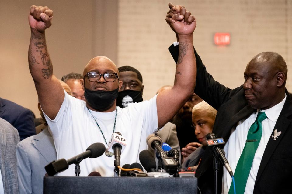 Terrence Floyd, brother of George Floyd, left, raises his hands during a news conference alongside attorney Ben Crump after former Minneapolis police Officer Derek Chauvin is convicted in the killing of George Floyd, (AP)