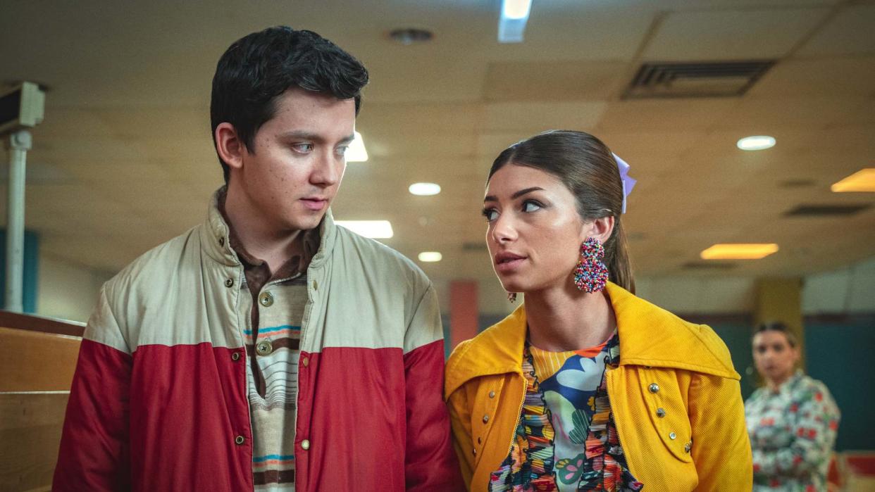   Asa Butterfield as Otis Milburn looks at Mimi Keene as Ruby Matthews in Sex Education on Netflix. 