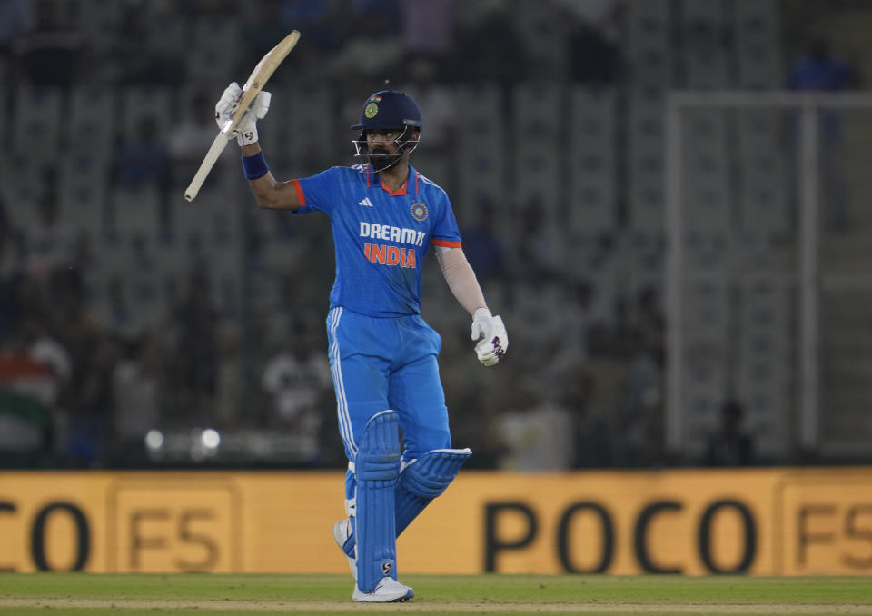 India's captain K L Rahul raises his bat as he celebrates scoring fifty runs during the first one day international match between Australia and India in Mohali, India, Friday, Sept. 22, 2023. (AP Photo/Altaf Qadri)