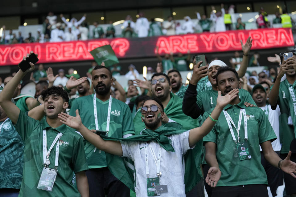 Saudi Arabia fans cheer prior of the World Cup group C soccer match between Poland and Saudi Arabia, at the Education City Stadium in Al Rayyan , Qatar, Saturday, Nov. 26, 2022. (AP Photo/Francisco Seco)