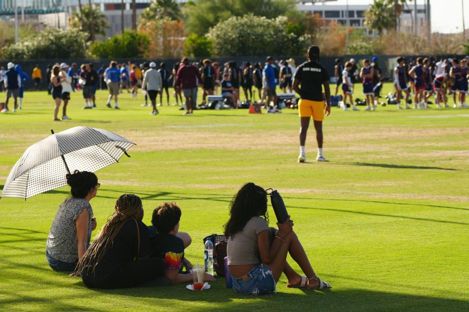 June 2, 2022; Tempe, Arizona; USA; Families and fans grab some shade during a 7-on-7 tournament, an ASU High School Football Showcase.