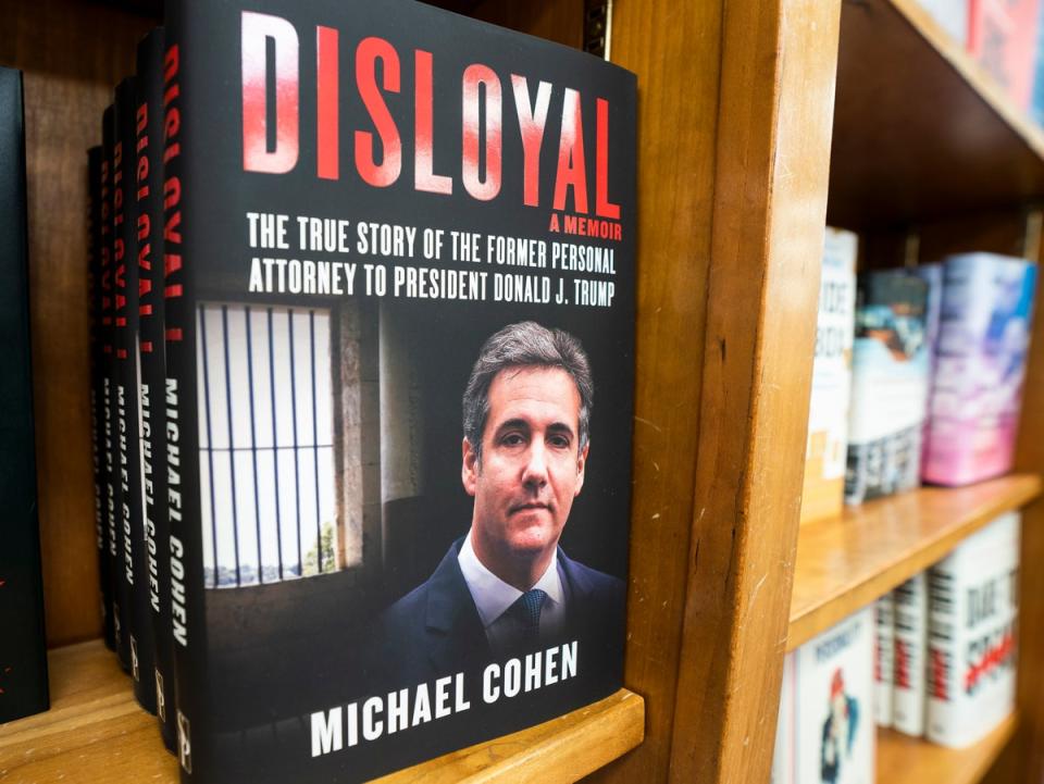 Copies of Michael Cohen’s book ‘Disloyal, a Memoir: The True Story of the Former personal attorney to President Donald Trump’ at the independent bookstore Politics and Prose in Washington, DC, on 10 September 2020 ((EPA))