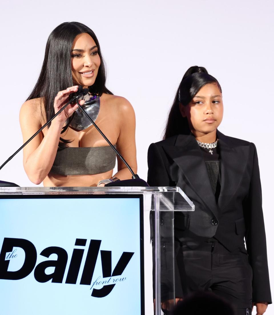 Kim and North at a podium