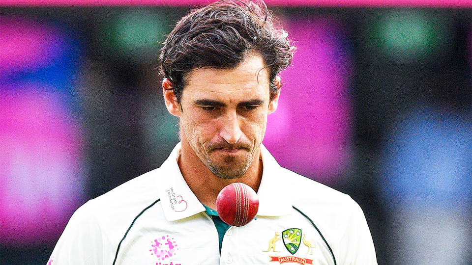 Mitchell Starc (pictured) tossing the ball ready to ball.