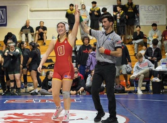 Oxnard's Tiarra Bibbens is declared the winner of a match during the Channel League wrestling championships on Saturday at San Marcos High. Bibbens won the 147-pound title and earned MVP honors.