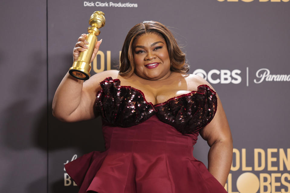 Da’vine Joy Randolph wearing Rodarte red dress on red carpet at Golden Globes.