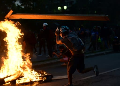 A demonstrator takes part in a violent protest in Santiago