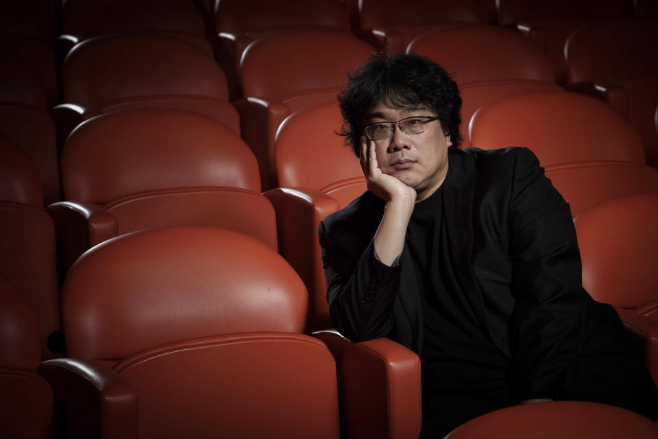 This Oct. 8, 2019 photo shows filmmaker Bong Joon-Ho posing for a portrait at the Whitby Hotel screening room in New York to promote his film "Parasite." The film will open in theaters Friday having already amassed $70.9 million in Bong's native South Korea. In May, "Parasite" won the Palme d’Or at the Cannes Film Festival, a first for a Korean film. (Photo by Christopher Smith/Invision/AP)