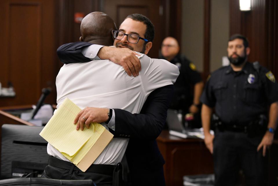 Seth Miller, executive director of the Innocence Project of Florida, hugs Edward Taylor in Jacksonville, Florida, on May 20, 2022, at the end of the hearing to clear Taylor's criminal record on false charges.