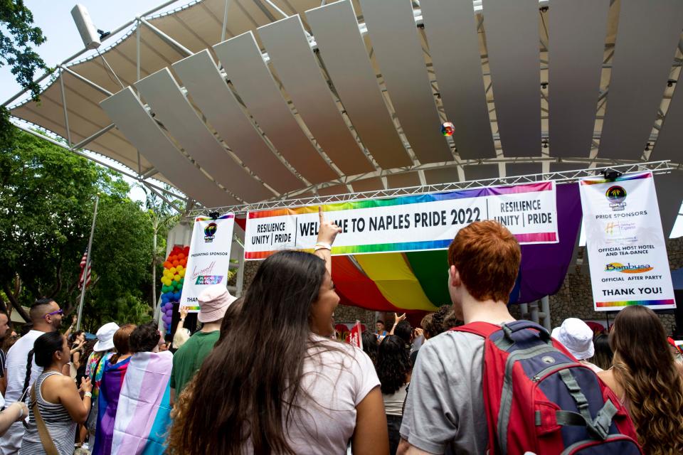 Attendees catch giveaways during the 4th Annual Naples Pride Fest, Saturday, July 9, 2022, at Cambier Park in Naples, Fla.