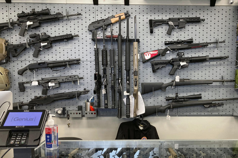 FILE - Firearms are displayed at a gun shop in Salem, Ore., on Feb. 19, 2021. An Oregon court decided Wednesday, Feb. 15, 2023, that local governments can't declare themselves Second Amendment sanctuaries and ban police from enforcing certain gun laws within their borders. The opinion was the first court test of the concept, which hundreds of U.S. counties have adopted in recent years. (AP Photo/Andrew Selsky, File)