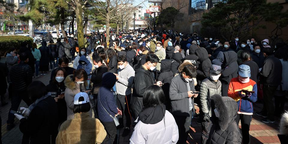 FILE - In this Feb. 24, 2020 file photo, People line up to buy face masks at a store in Daegu, South Korea. As fears of a soaring viral outbreak grip the southeastern South Korean city of Daegu and nearby areas, many residents are struggling as they try to avoid the new virus. (Lee Moo-ryul/Newsis via AP, File)