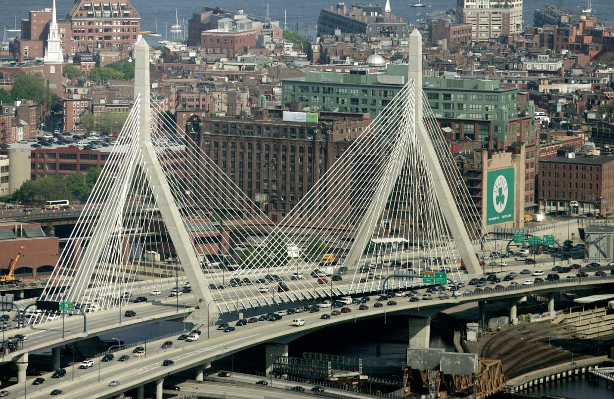 <span class="caption">The Leonard P. Zakim Bunker Hill Bridge was part of Boston's Big Dig, which was infamous for its cost overruns.</span> <span class="attribution"><a class="link " href="https://newsroom.ap.org/detail/BIGDIG/e90b50ac30f6da11af9f0014c2589dfb/photo?Query=big%20dig%20zakim%20bridge&mediaType=photo&sortBy=arrivaldatetime:desc&dateRange=Anytime&totalCount=2&currentItemNo=1" rel="nofollow noopener" target="_blank" data-ylk="slk:AP Photo/Steven Senne;elm:context_link;itc:0;sec:content-canvas">AP Photo/Steven Senne</a></span>