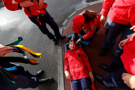 Members of firefighter school perform first aid exercises during a training session in Oliveira do Hospital, Portugal November 10, 2018. Picture taken November 10, 2018. REUTERS/Rafael Marchante