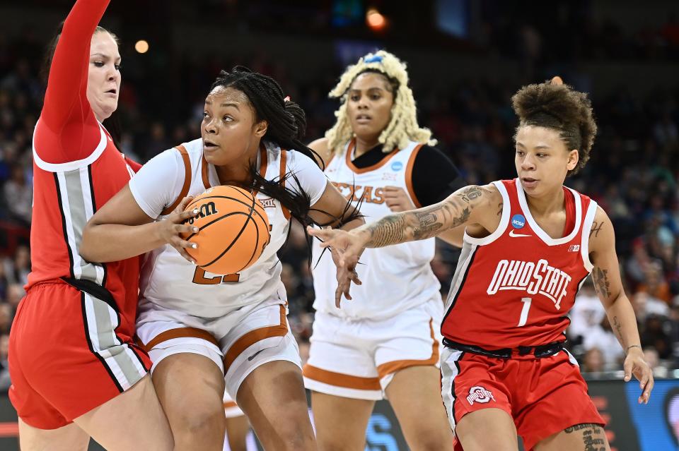 Texas forward Aaliyah Moore works for positioning against Ohio State forward Rebeka Mikulasikova during a March 2022 Sweet 16 matchup in the NCAA Tournament.