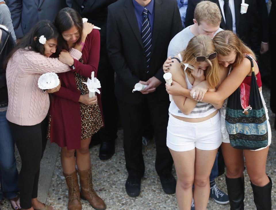 UC Santa Barbara students attend a candlelight vigil following Friday's series of drive-by shootings in Isla Vista