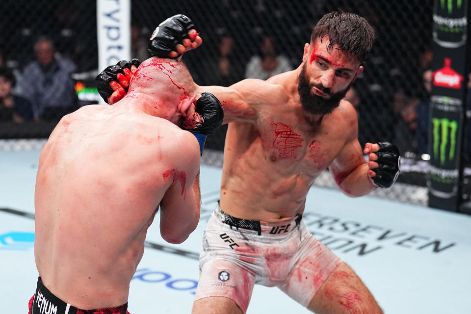 NEW YORK, NEW YORK - NOVEMBER 11: Nazim Sadykhov of Russia punches Viacheslav Borshchev of Russia in a lightweight fight during the UFC 295 event at Madison Square Garden on November 11, 2023 in New York City. (Photo by Chris Unger/Zuffa LLC via Getty Images)